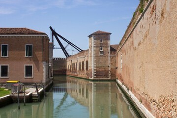 Fototapeta na wymiar Rio de le Vergini in Venice, with the historic Arsenal walls