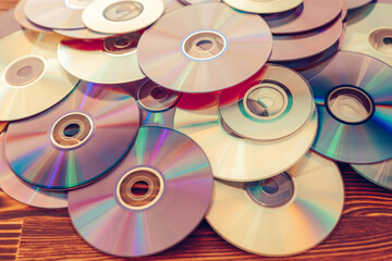 Old technology, waste compact disc collection decoration for vintage pattern. cd background concept.