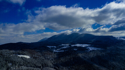 Carpathian mountains mountain range pine forests coniferous mountain tops winter snow aerial photography