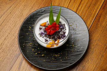 Jelly cream dessert in a bowl beautifly decorated with edible flowers. 