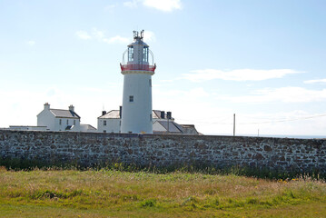 Fototapeta na wymiar Lighthouse on a cliff in Howth, Ireland