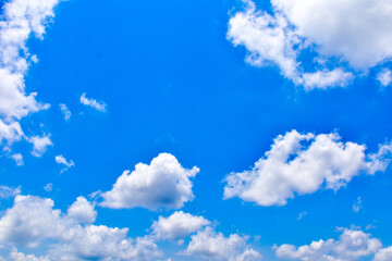 Fototapeta na wymiar The white cloud cumulus in the blue sky background.