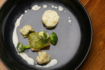 Tuna in lemon dill sauce. Exquisite dish, creative restaurant meal concept.