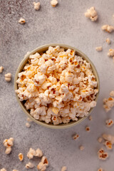 Obraz na płótnie Canvas Popcorn in the bowl. Corn to watch movies. Popcorn close-top view