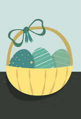 Basket with a ribbon filled with Easter eggs. Black and turquoise background