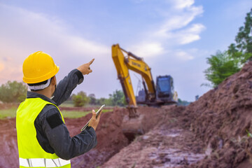 View of the backhoe was digging a pit in the ground. © venusvi