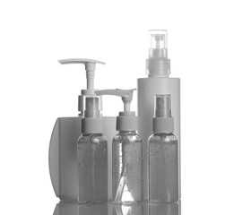 Many hand sanitizer bottles on white table. Alcohol gel antibacterial soap sanitizer, hands disinfection.