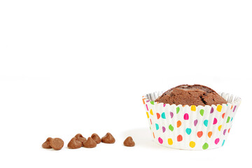 Chocolate cupcake/muffin in spotty cake case shot against white background