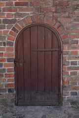 old church door with bricks 