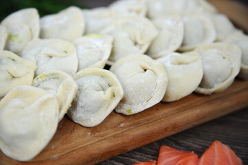 Dumplings manual molding. Rustic food. Selective focus.