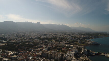 Cyprus Kyrenia Drone Footage from sky mountains city view Mediterranean sea Girne North Cyprus KKTC blue color best holiday summer sunny