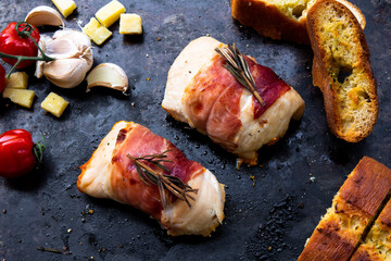 succulent chicken breasts filled with creamy parmigiana stuffing and wrapped in prosciutto