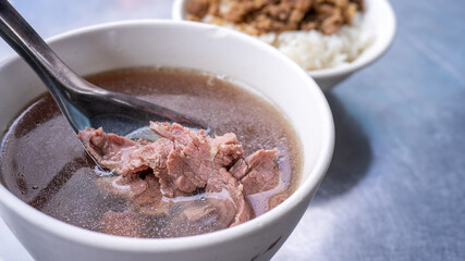 Beef soup - famous food in Taiwan, Asia, Asian Taiwanese street delicacy cuisine, close up, lifestyles, traditional breakfast in Tainan.