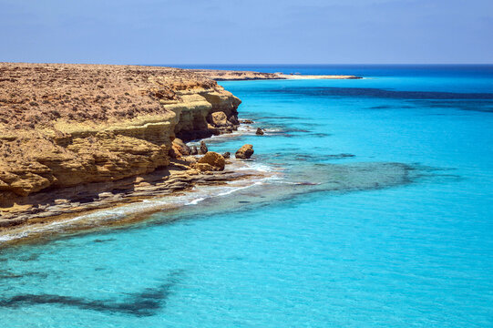 Turquoise blue sea view with rocky shores, Mediterranean sea landscape, seascape, cliffs in Ageeba beach, holidays in Marsa Matrouh, Egypt