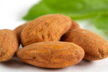A pile of Almonds, isolated on a white background.