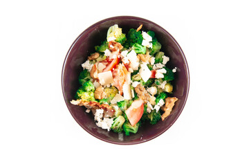 Broccoli Salad with Bacon, parmesan cheese in a black plate. Top view isolated on white.
