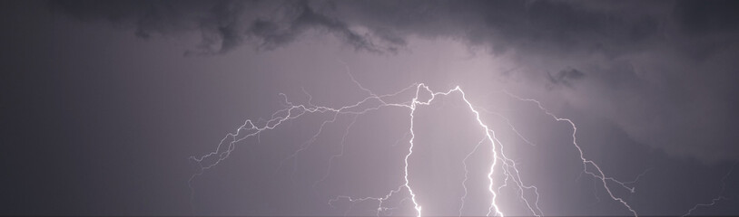 Lightning bolts in the sky at night