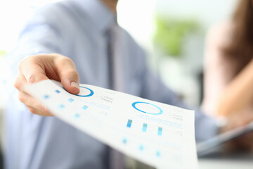 Focused photo on male hand that holding document