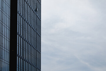 Fototapeta na wymiar blue sky and facade part of industrial glass