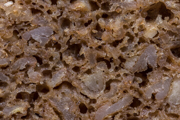 Extreme close-up photo of German dark rye bread, known as Pumpernickel