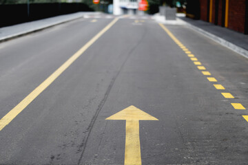yellow arrow on the asphalt