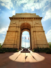 Fototapeta na wymiar The India Gate is located in the center of New Delhi. The capital of India. Background blue sky clouds