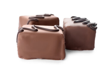 Delicious milk chocolate candies isolated on white