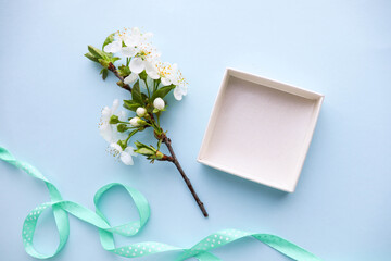 romantic composition. open empty gift box and a bouquet of spring flowers. space for text
