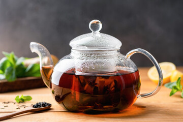 Black tea brewed in glass tea pot. Chinese black tea. Copy space