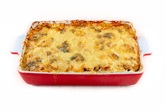 Baked Potatoes With Mushrooms; Cheese Crust; Ceramic Tray Isolated On White.