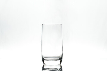 Empty glass on white background. Isolated. Backlight.