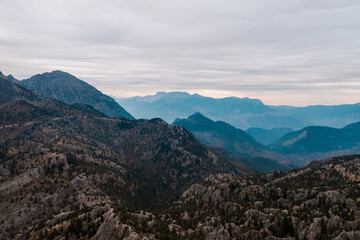 Fototapeta premium Antalya, Gundogmus. Landscape with picturesque view, rocky land and mountains with morning sky in background. Stability and earth power