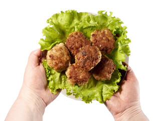 Fried cutlets on a dark plate.