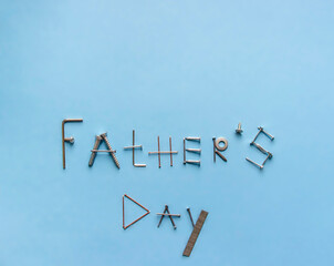 against a blue background with metal products, carnations and screws written father's day
