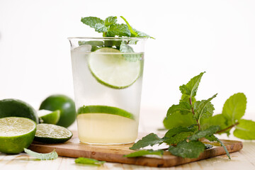 Lemonade or mojito cocktail with fresh lime and mint leaves
