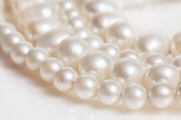 Pearl necklace on white background.
