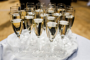 Glasses filled with champagne.