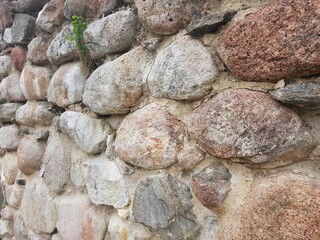 The fence of large strong boulder stones reliable protection of the estate