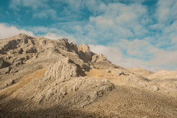 Landscape with picturesque view, rocky land and mountains with morning sky in background. Stability and earth power. Turkey