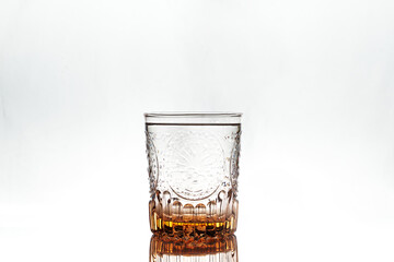 Full glass on white background. Isolated. Backlight.