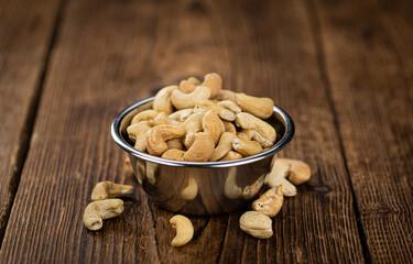 Some roasted Cashew Nuts (close up; selective focus)