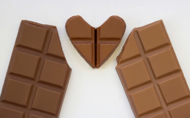 love heart chocolate with chocolate bar on white background