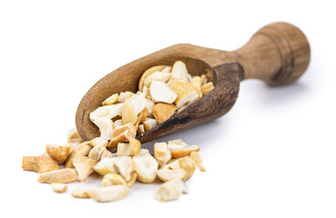 Chopped Cashew nuts isolated on white background (close-up shot)