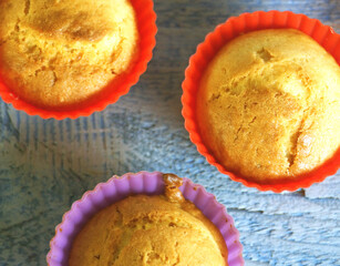 Cupcakes (muffin) on a blue wooden background view from above close  