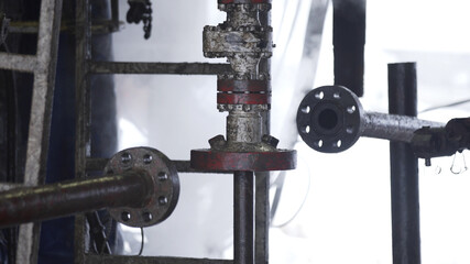 Installation of industrial oil pump equipment for pumping crude oil for fossil fuel energy with drilling rig in oil field after drilling well. Equipment for wellhead connection oil well.