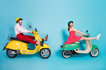 Fototapeta premium Full size profile side photo of crazy funny two people motorcyclist ride motor bike high speed scream rejoice wear red dotted dress shirt isolated over blue color background