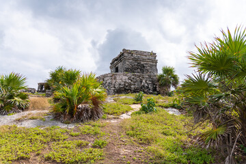 Fototapeta na wymiar Tulum Ruins - Old Mayan landmark besides Caribbean Sea. Riviera Maya, Traveling America (popular travel destination, maybe after the Corona crisis) - Tulum, Mexico