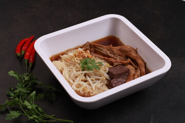 Duck noodle soup isolated black background, one of famous soup in Thailand