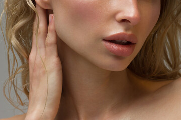 Sexual full lips. Natural gloss of lips and woman's skin. The mouth is closed. Increase in lips, cosmetology. Natural lips. Great summer mood with open eyes. fashion jewelry. Pink lip gloss