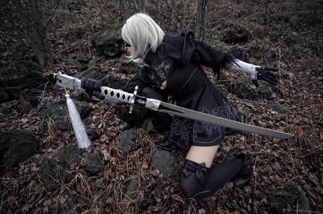 woman in white wig and sword outdoors, cosplay